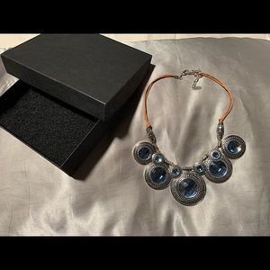 Silver and brown leather necklace.